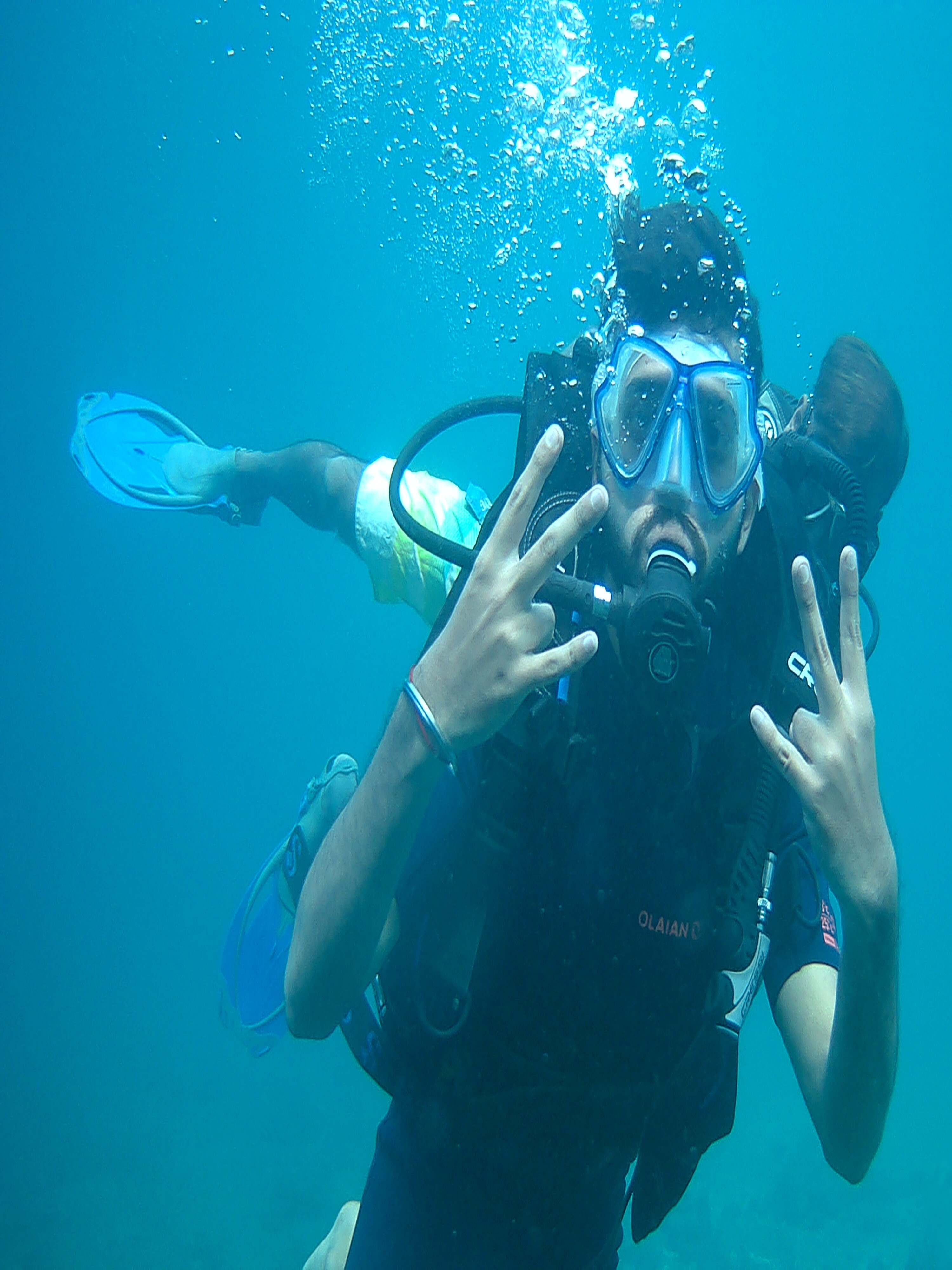 Speedboat journey to Netrani Island, with friends wearing safety jackets and sunglasses on the open sea