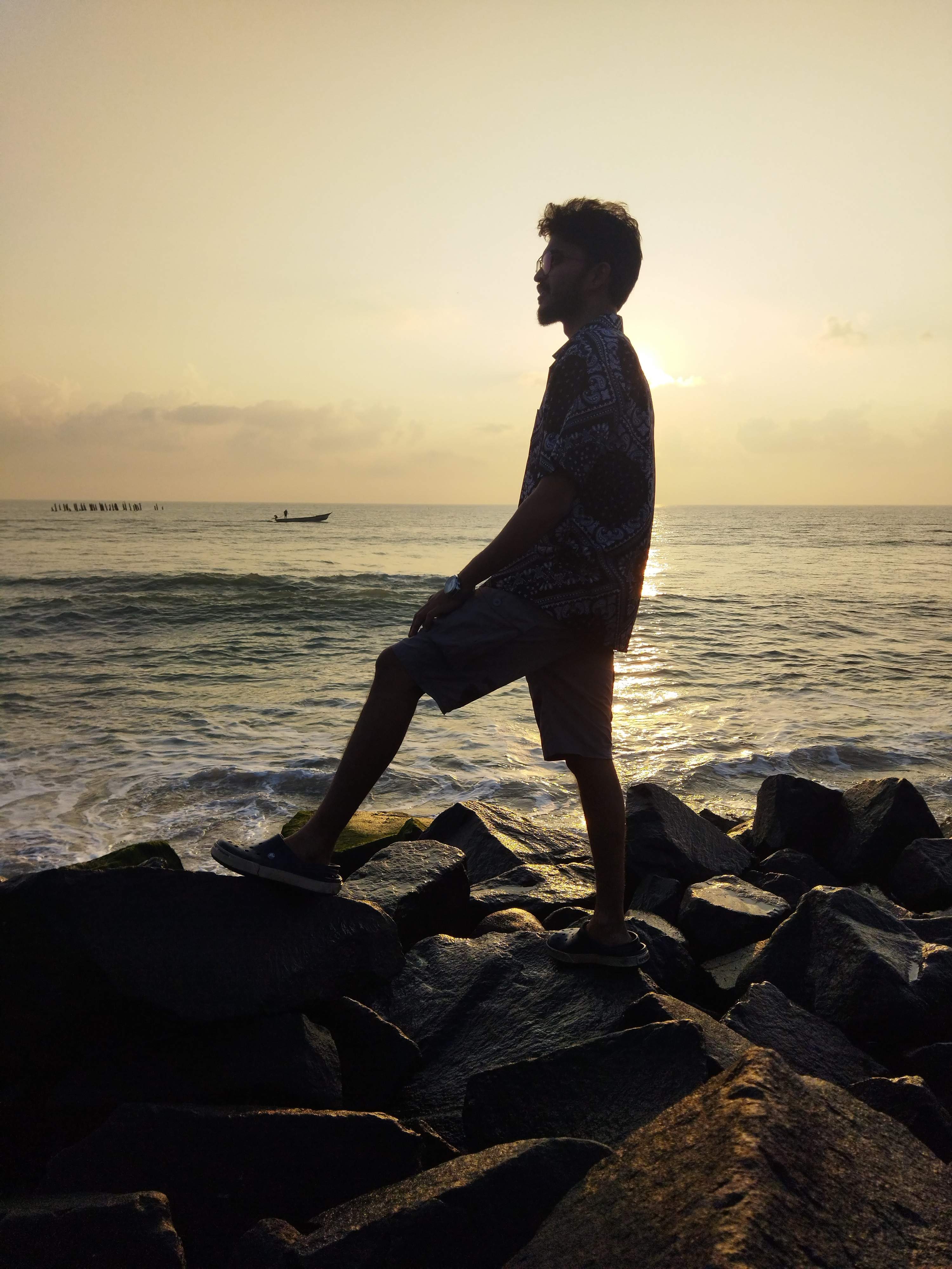 Rocky shore and calm waves at Rock Beach, Pondicherry