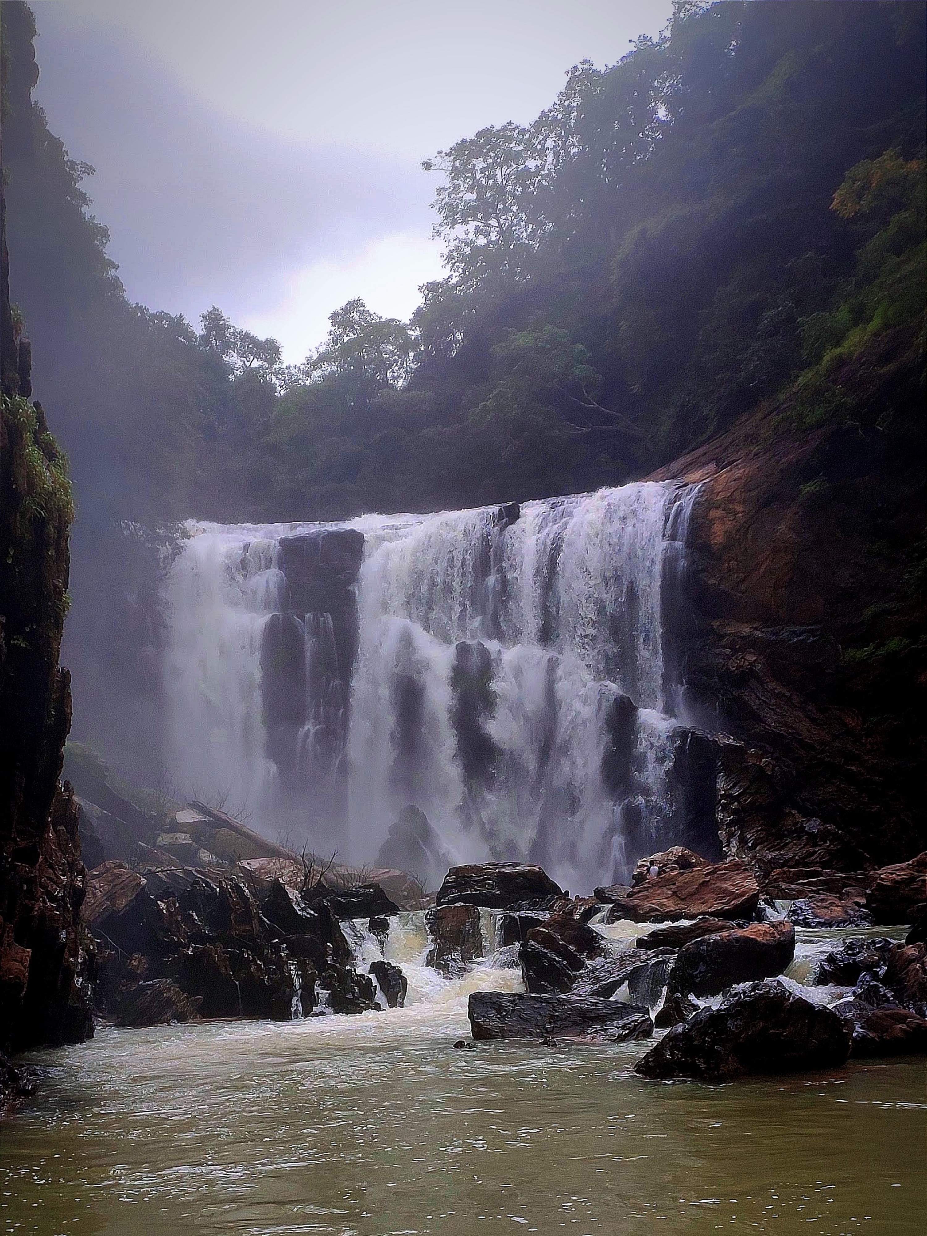 Majestic Sathodi Falls cascading down in the Western Ghats with lush green surroundings and misty waters