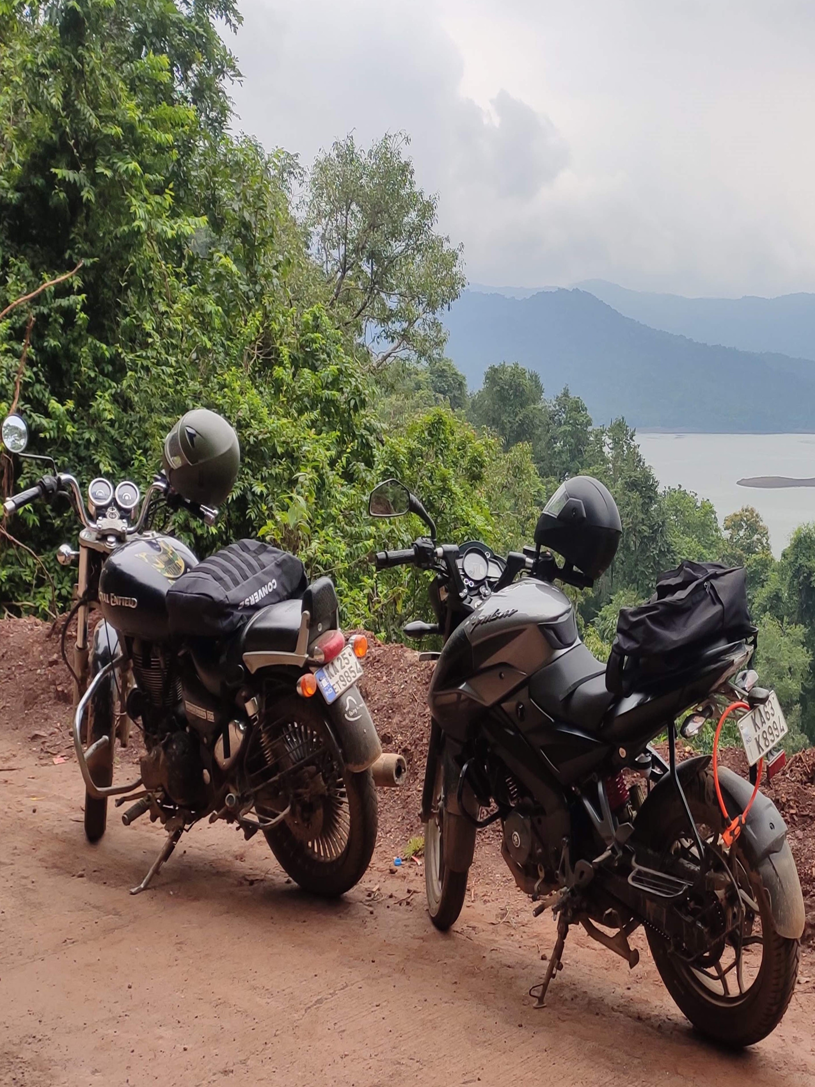 Visitors enjoying the water at Sathodi Falls, swimming and playing in the strong currents near the base