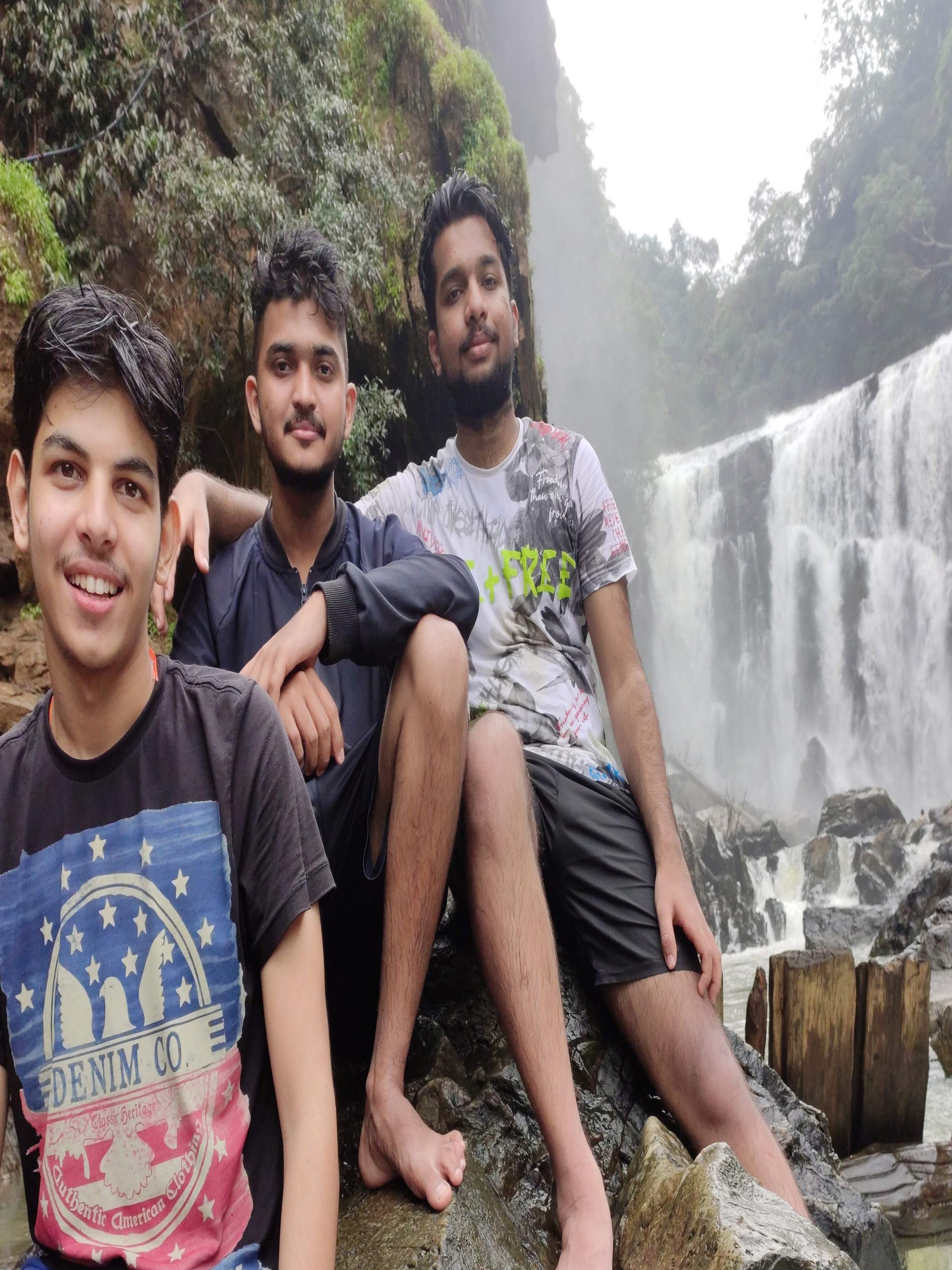 Peaceful riverside roads through the Western Ghats with greenery and calm waters during the return bike trip from Sathodi Falls