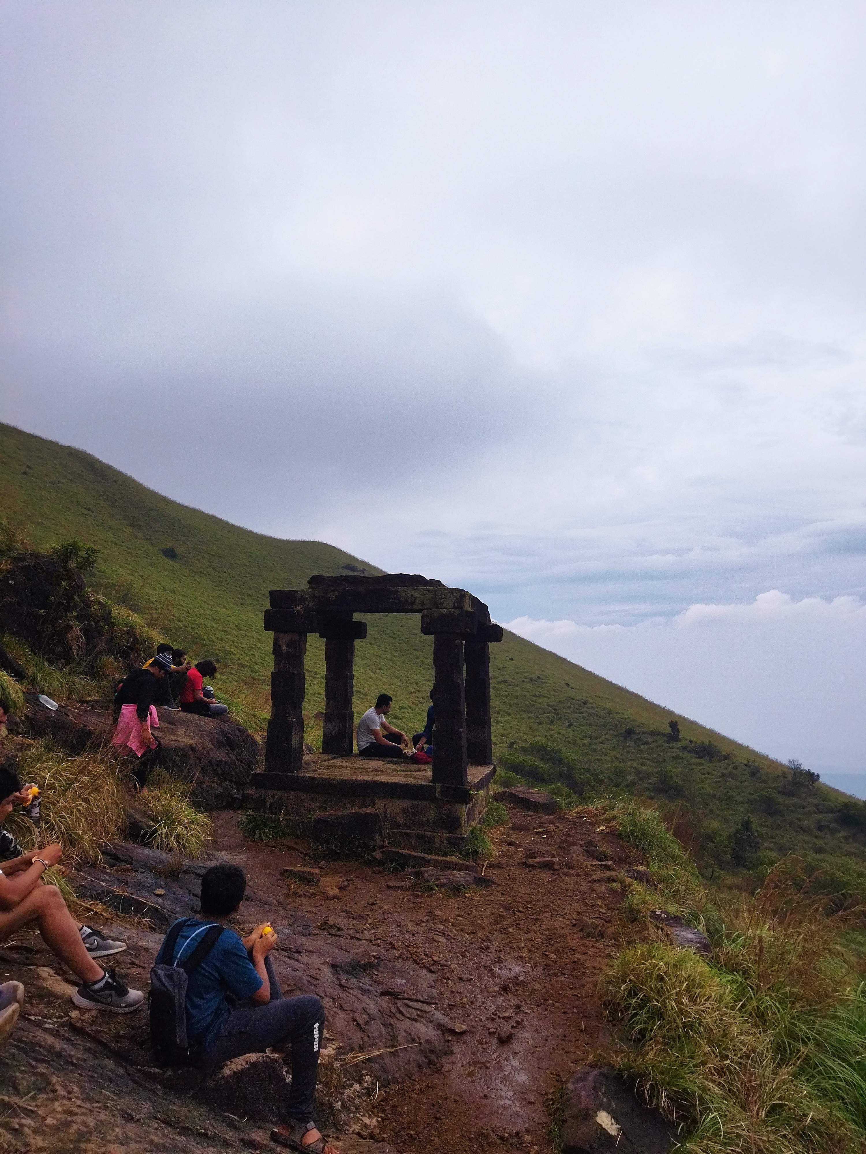 Kallu Mantapa rock structure amidst mountain ranges