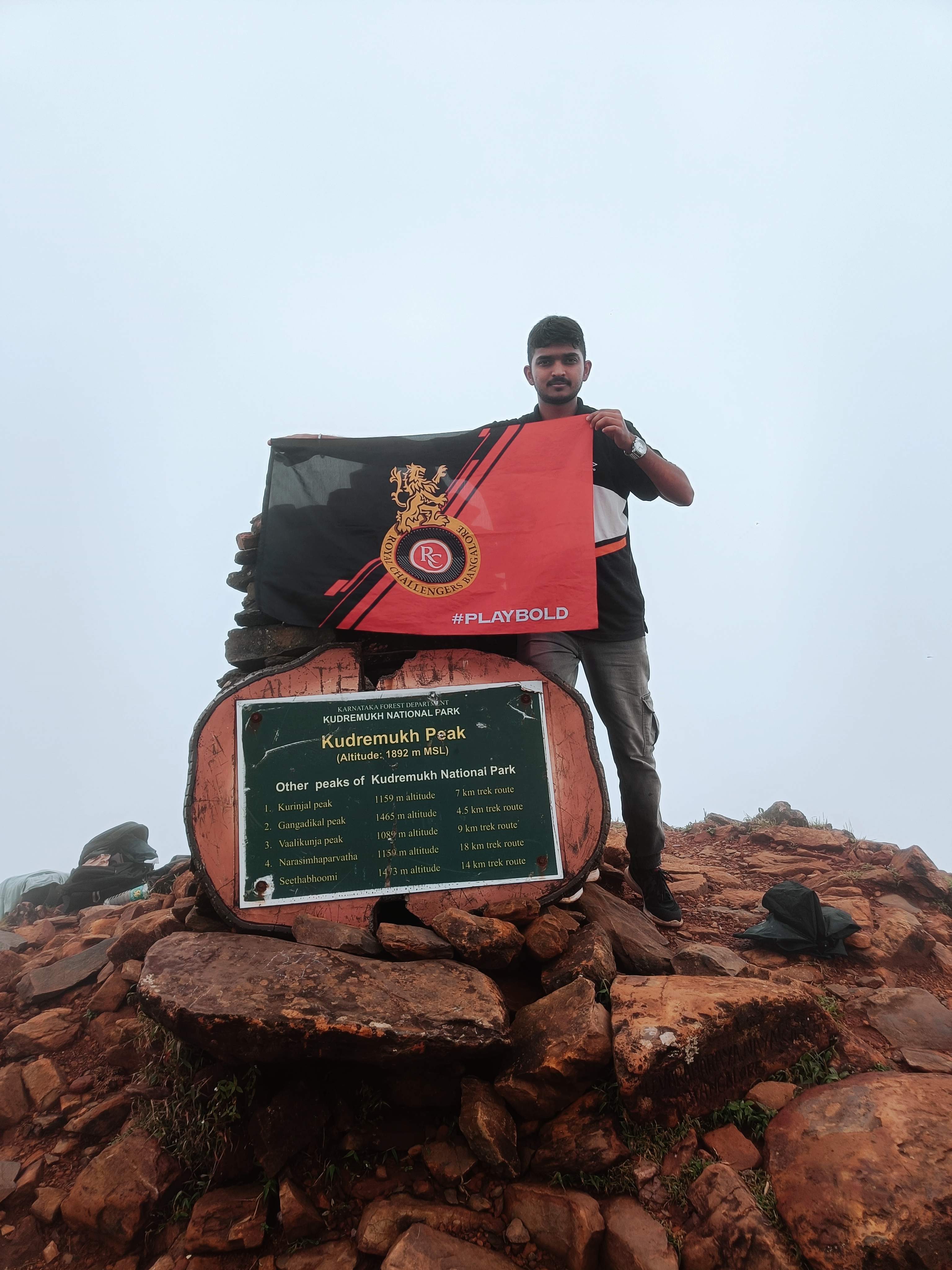 Summit of Kudremukha peak at 1892 meters with RCB flag
