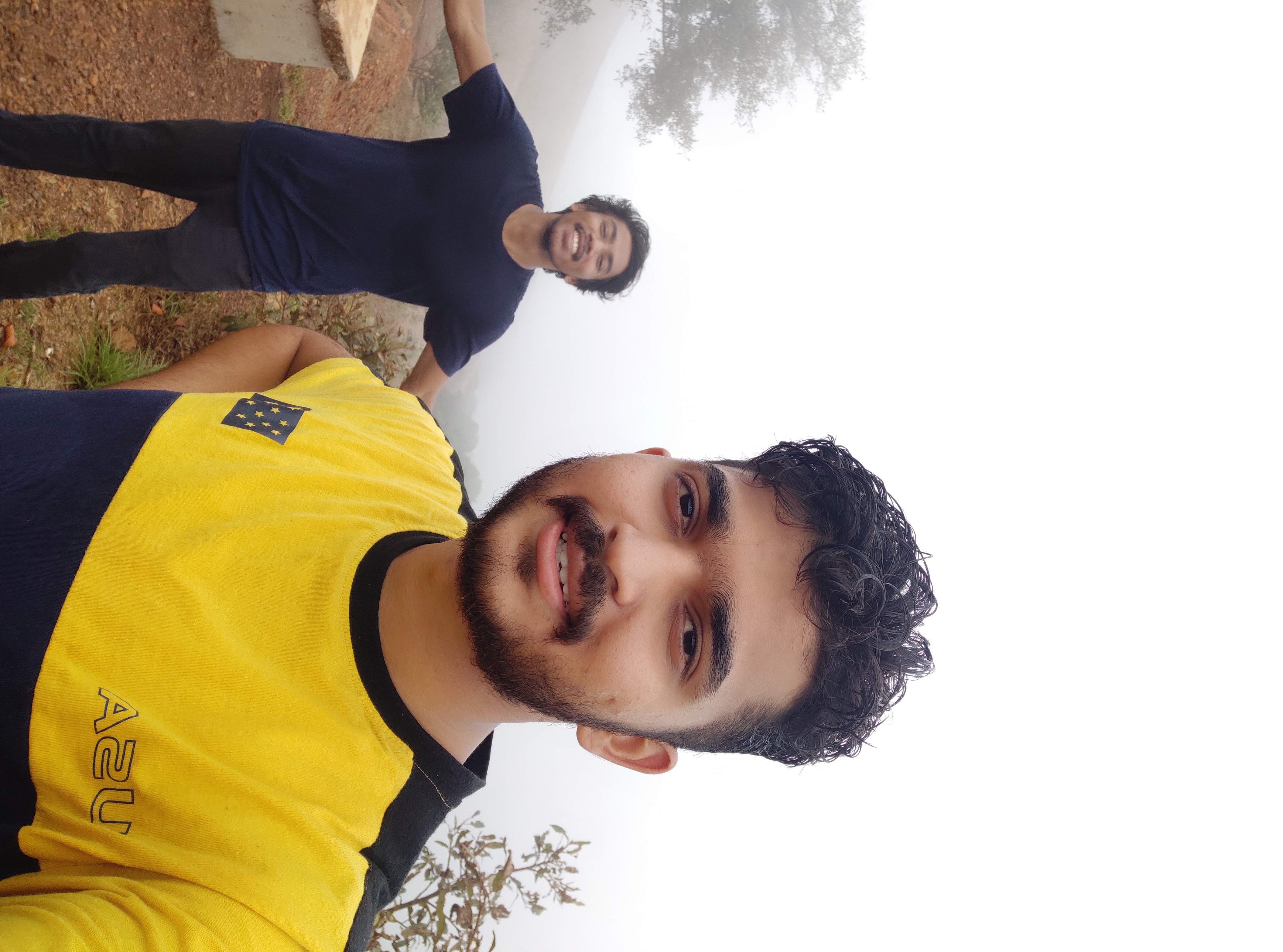 Emerging from dense forest onto red mud road at Kodachadri