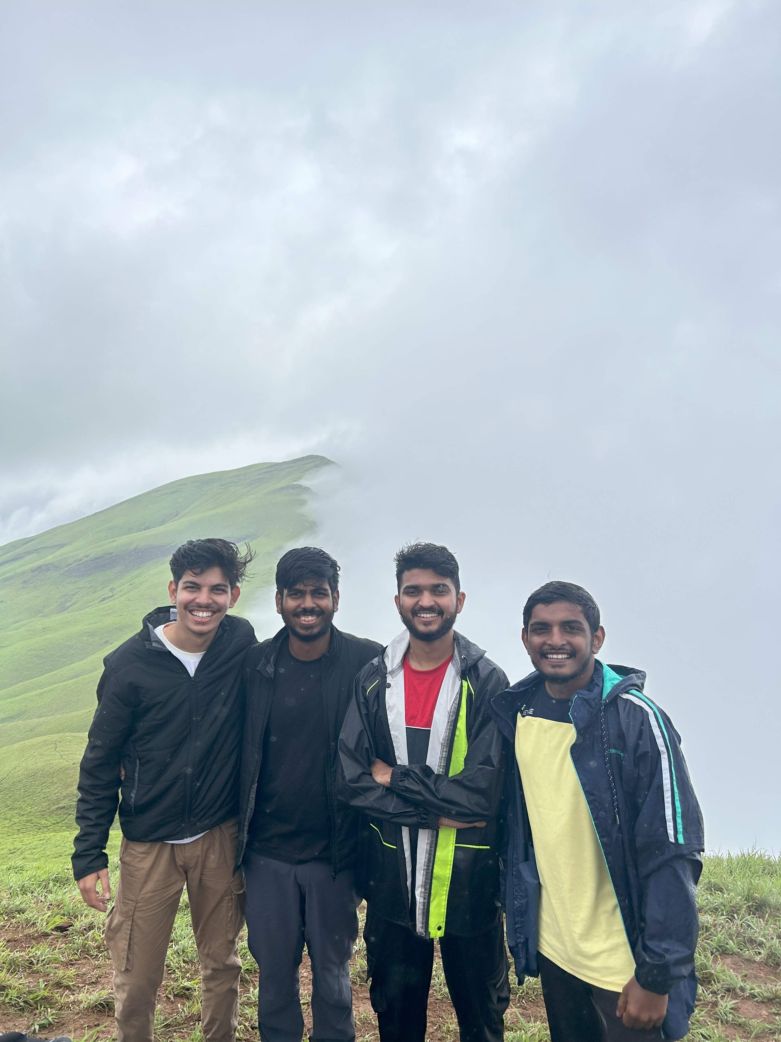 Summit view with clouds over mountains