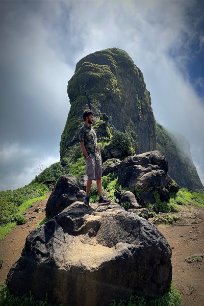 Harihara Fort trek featuring steep cliffs and panoramic views, a challenge for acrophobia