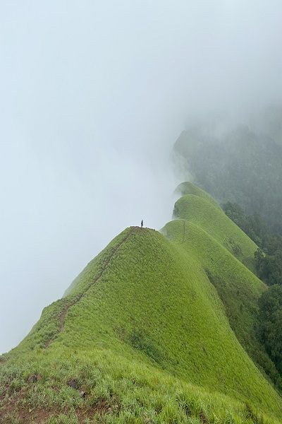 Netravathi Peak trek with mountains kissing the clouds in a serene landscape