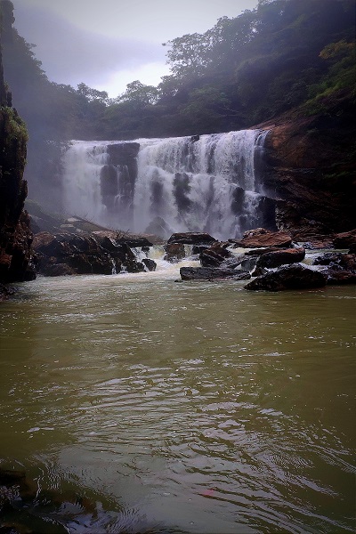 Sathodi Falls in Karnataka, a scenic waterfall with clear waters and greenery